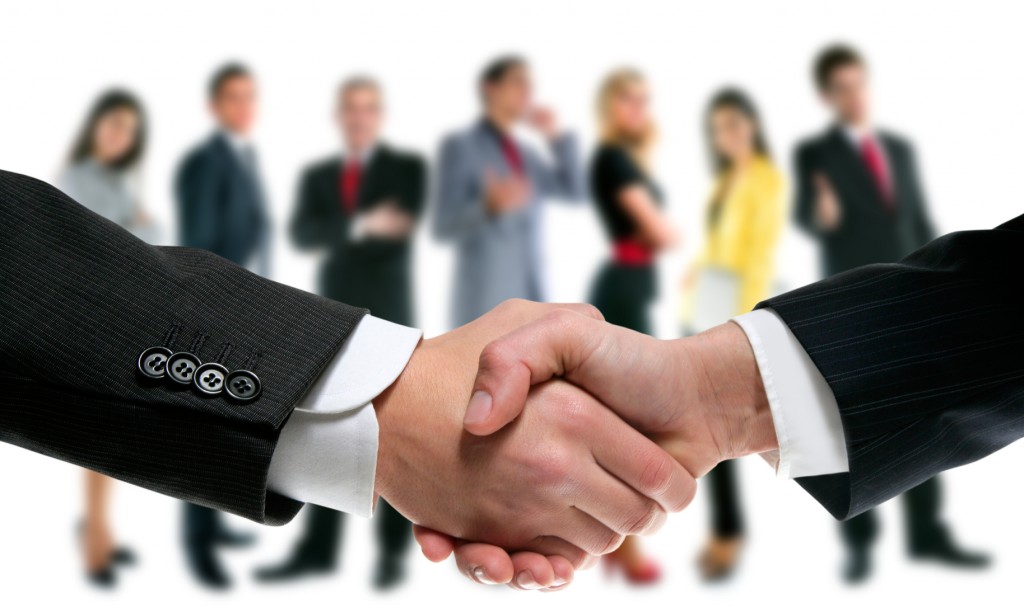 Business people handshake and company team